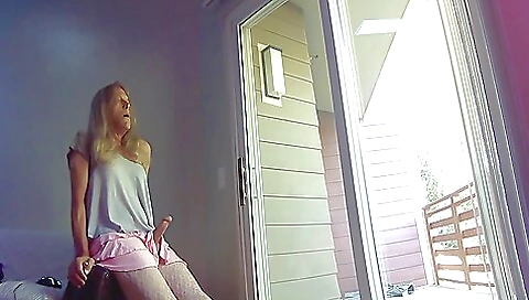 Blonde granny flashing her phone on a private camera