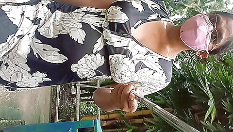 Man gets naked on the ground on the park in a solo video