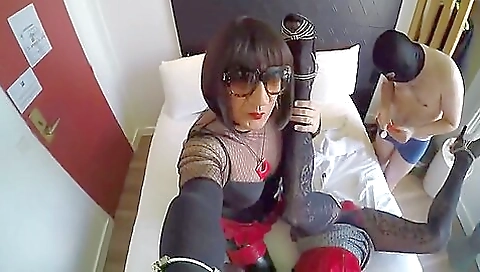 Hot brunette is playing with her pussy in the hotel room