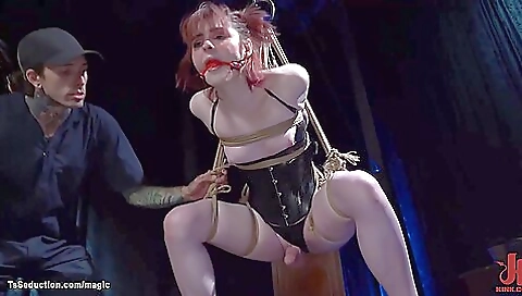 Bondage gagging with a red-haired girl in bondage uniform
